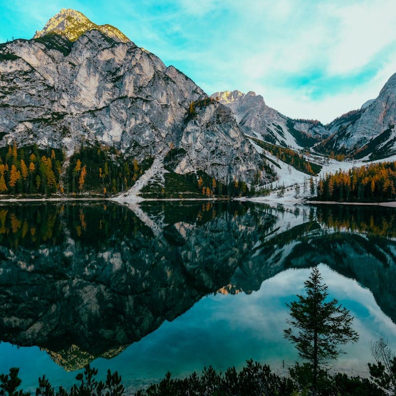 Mountain lake with teal sky — cool-toned reference