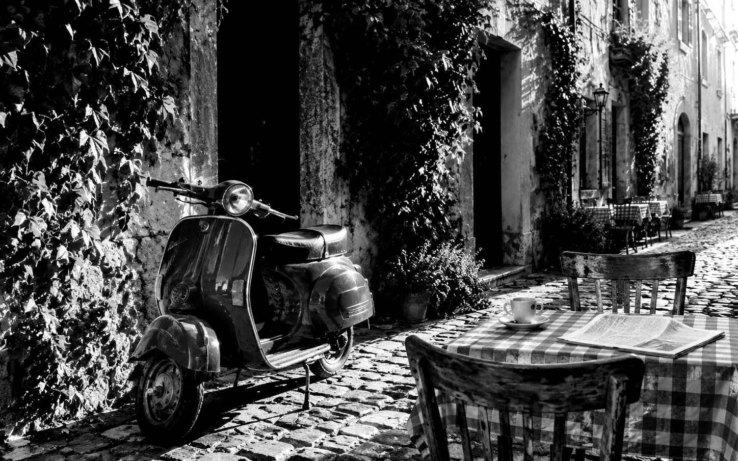 Vintage Vespa cafe scene with Ilford HP5 black and white film preset, high contrast desaturation